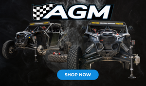 AMG "Shop Now" Banner emphasizing "The Electric Jack" holding up a Can-Am Maverick X3 with a tire off
